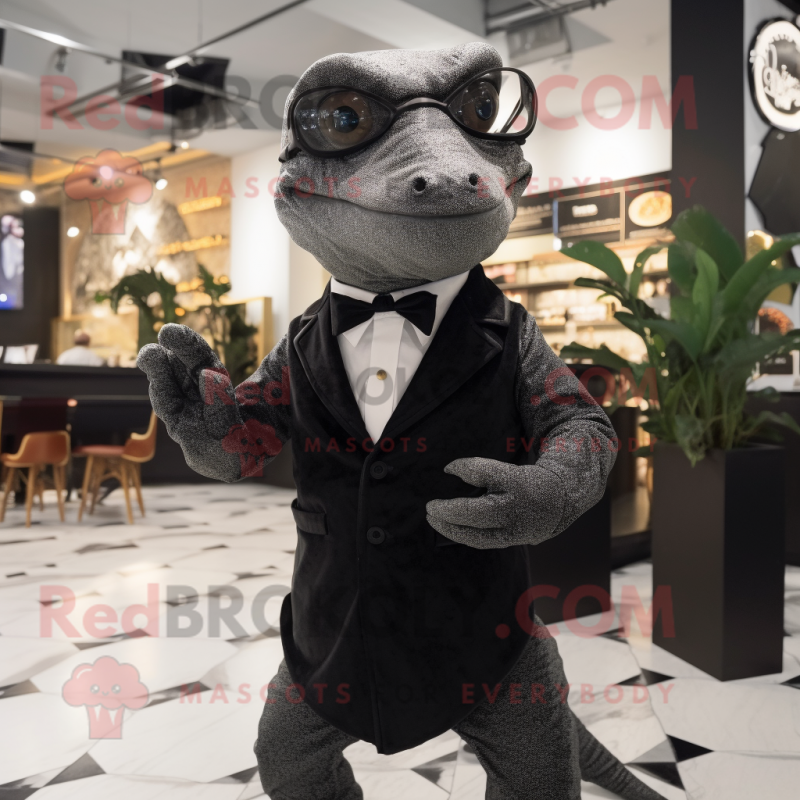 nan Komodo Dragon mascot costume character dressed with a Tuxedo and Eyeglasses