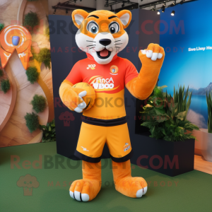 Orange Puma mascot costume character dressed with a Rugby Shirt and Gloves