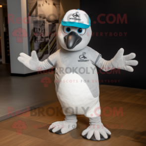 Silver Quail mascot costume character dressed with a T-Shirt and Beanies