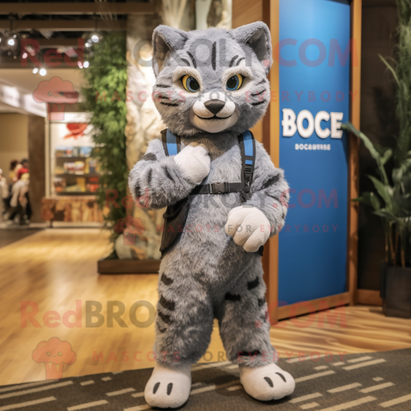 Gray Bobcat mascot costume character dressed with a Overalls and Shawls