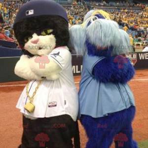 2 mascots a black and white cat and a blue furry man -