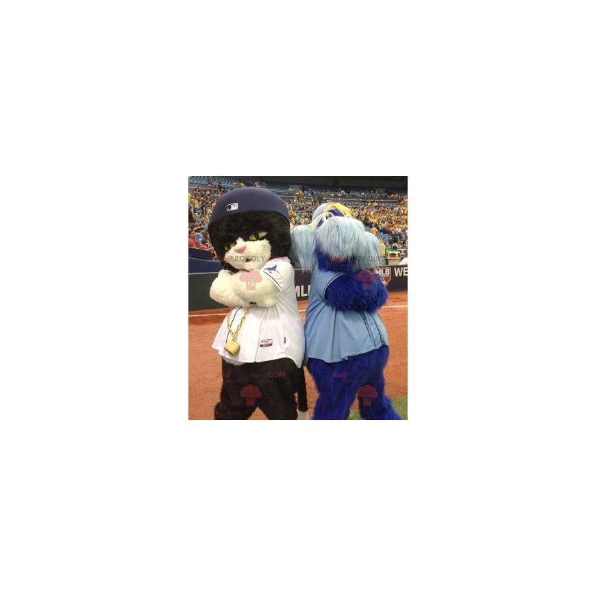 2 mascots a black and white cat and a blue furry man -