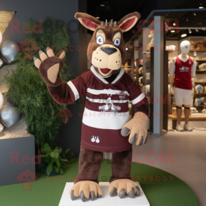 Maroon Okapi mascot costume character dressed with a Rugby Shirt and Mittens