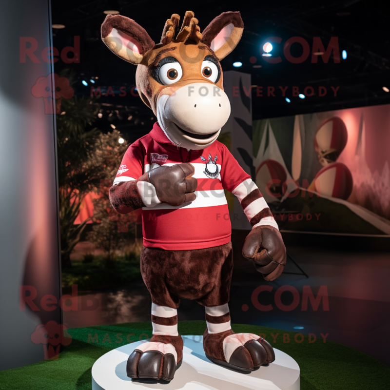 Maroon Okapi mascot costume character dressed with a Rugby Shirt and Mittens