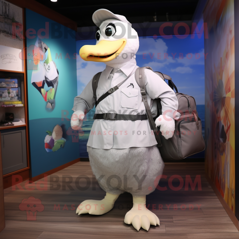 Silver Goose mascot costume character dressed with a Poplin Shirt and Backpacks Silver Goose mascot costume character dressed with a Poplin Shirt and Backpacks
