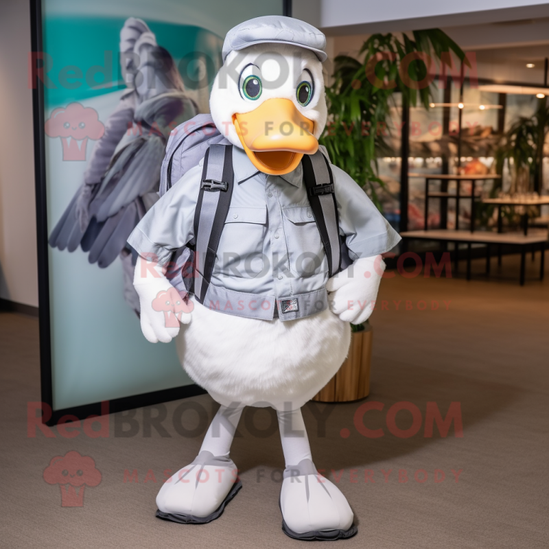 Silver Goose mascot costume character dressed with a Poplin Shirt and Backpacks Silver Goose mascot costume character dressed with a Poplin Shirt and Backpacks