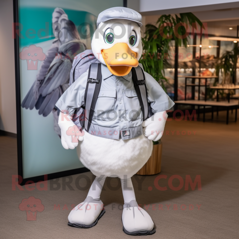 Silver Goose mascot costume character dressed with a Poplin Shirt and Backpacks