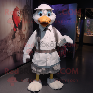 Silver Goose mascot costume character dressed with a Poplin Shirt and Backpacks