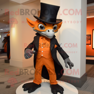 Orange Gargoyle mascot costume character dressed with a Tuxedo and Hat pins