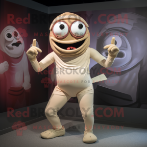 Beige Cyclops mascot costume character dressed with a Rash Guard and Ties