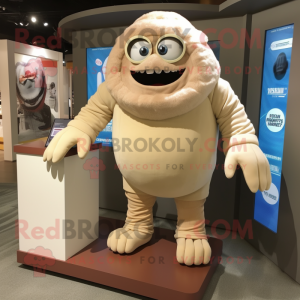 Beige Cyclops mascot costume character dressed with a Rash Guard and Ties