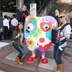 Mascotte gigante del dente bianco macchiato di colori -