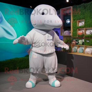 Gray Beluga Whale mascot costume character dressed with a Shorts and Brooches