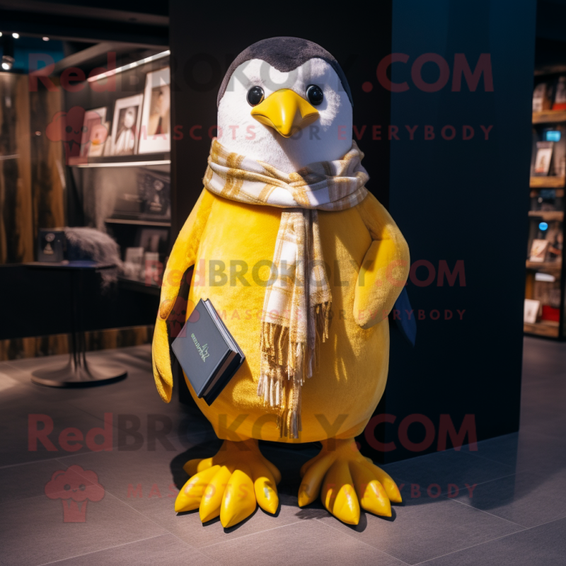 Gold Penguin mascot costume character dressed with a Oxford Shirt and Scarves