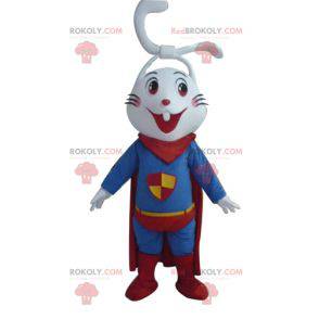 Very smiling white rabbit mascot dressed as a superhero -