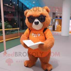 Peach Sloth Bear mascot costume character dressed with a Long Sleeve Tee and Reading glasses