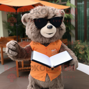 Peach Sloth Bear mascot costume character dressed with a Long Sleeve Tee and Reading glasses