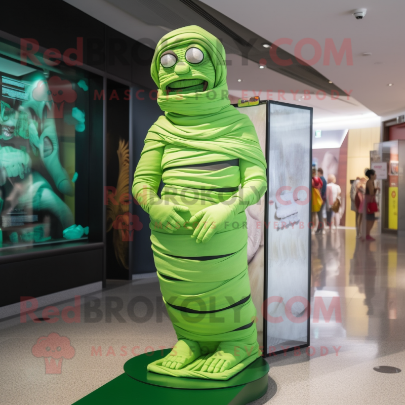 Lime Green Mummy mascot costume character dressed with a Bikini and Watches Lime Green Mummy mascot costume character dressed with a Bikini and Watches