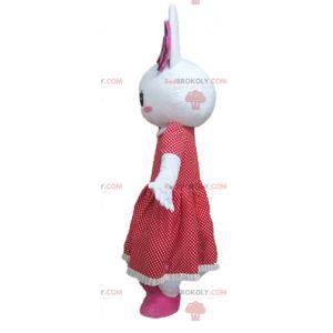 Mascote coelho branco com vestido de bolinhas vermelhas -