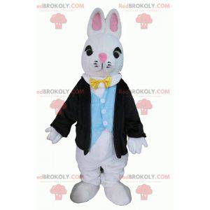 Wit konijn mascotte gekleed in een zeer stijlvol kostuum -