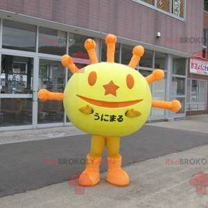 Mascote em forma de sol amarelo e laranja - Redbrokoly.com