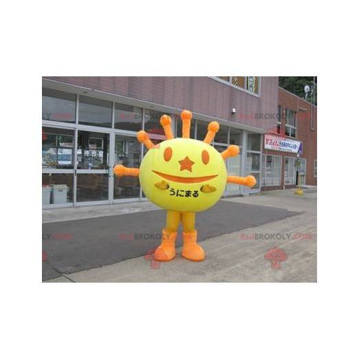 Mascote em forma de sol amarelo e laranja - Redbrokoly.com