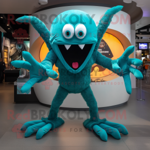 Teal Spider mascot costume character dressed with a V-Neck Tee and Rings