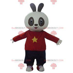 White and black rabbit mascot in red and black outfit -