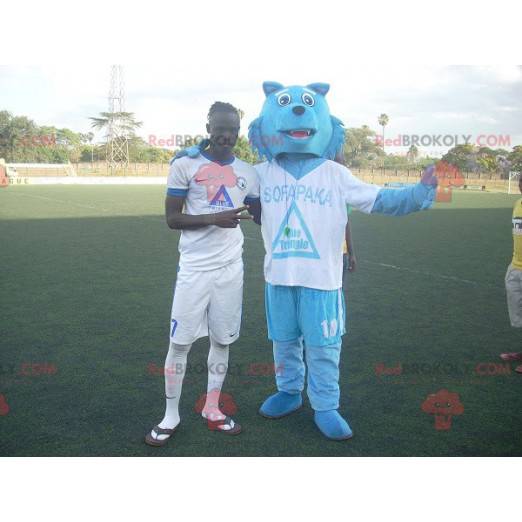 Blue wolf mascot in sportswear - Redbrokoly.com
