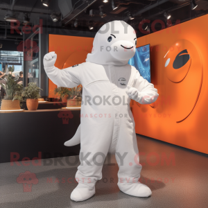 Rust Beluga Whale mascot costume character dressed with a Jumpsuit and Hats