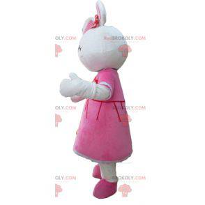 Leuk wit konijn mascotte gekleed in een roze jurk -