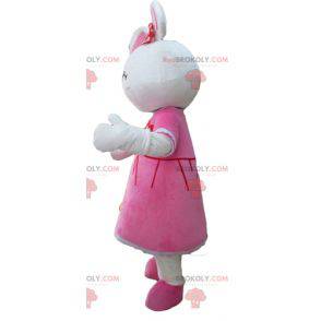 Mascotte simpatico coniglio bianco vestito con un abito rosa -