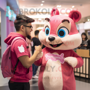 Pink Chipmunk mascot costume character dressed with a Graphic Tee and Watches