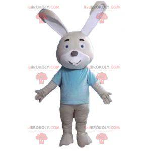 Mascotte de lapin beige et blanc avec un t-shirt bleu -