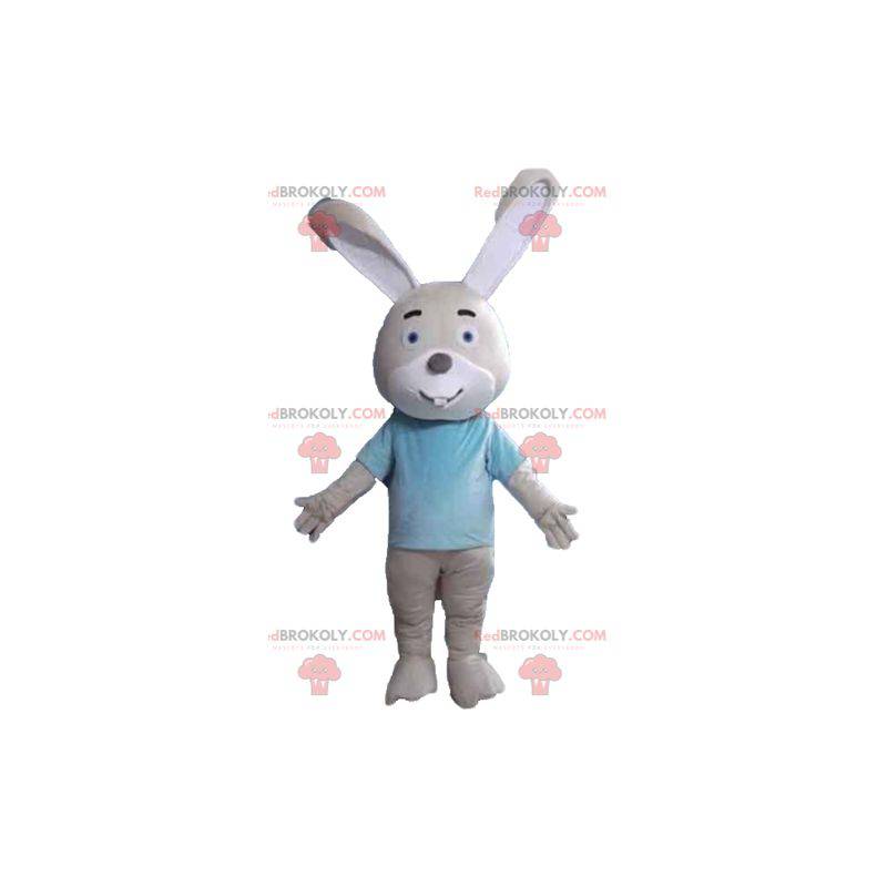 Beige and white rabbit mascot with a blue t-shirt -