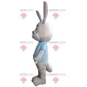 Beige and white rabbit mascot with a blue t-shirt -