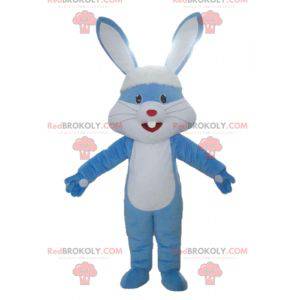 Mascota gigante de conejo azul y blanco con orejas grandes -