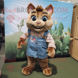 Brown Cat mascot costume character dressed with a Chambray Shirt and Wraps