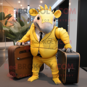 Yellow Armadillo mascot costume character dressed with a Suit Jacket and Briefcases