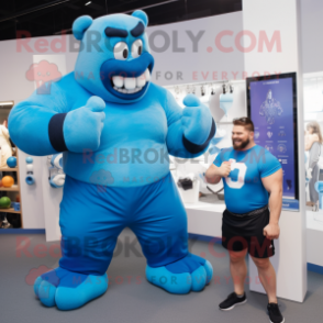 Blue Strongman mascot costume character dressed with a Polo Tee and Watches