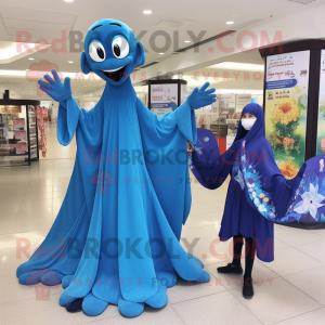 Blue Stilt Walker mascot costume character dressed with a Dress and Shawls