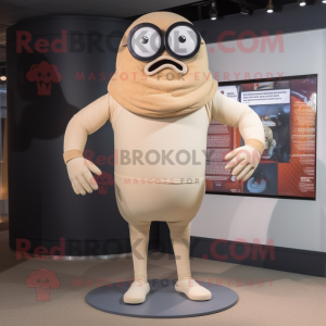 Beige Cyclops mascot costume character dressed with a Rash Guard and Ties