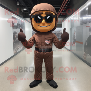 Brown Knife Thrower mascot costume character dressed with a Jumpsuit and Eyeglasses