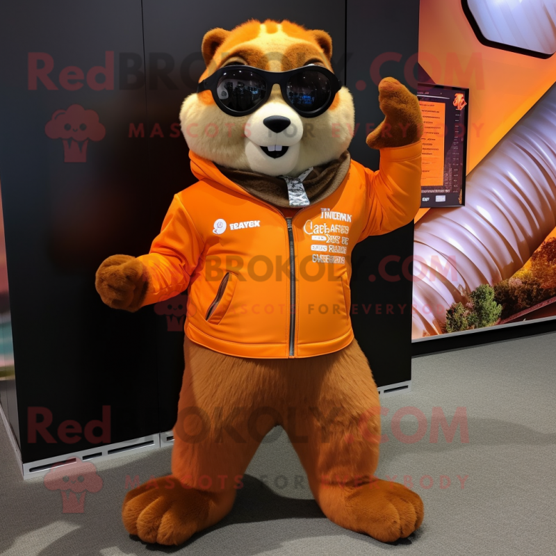 Orange Marmot mascot costume character dressed with a Moto Jacket and Scarf clips Orange Marmot mascot costume character dressed with a Moto Jacket and Scarf clips