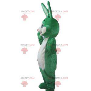 Mascotte de lapin vert et blanc souriant et original -