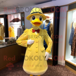 Yellow Muscovy Duck mascot costume character dressed with a Sheath Dress and Hat pins