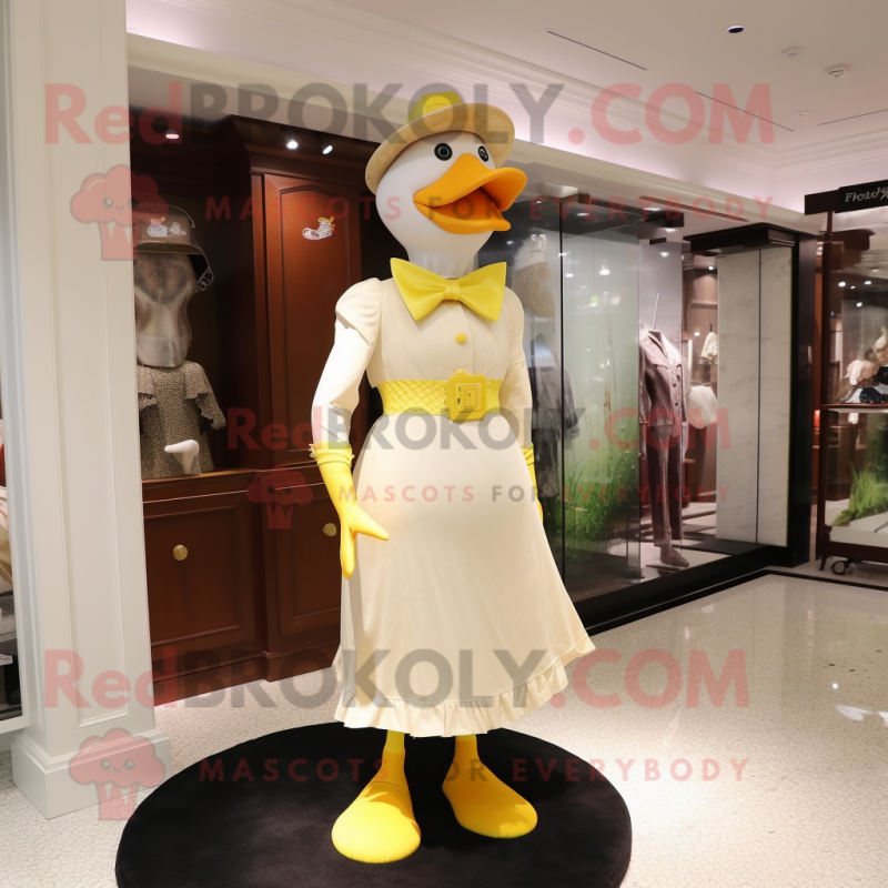 Yellow Muscovy Duck mascot costume character dressed with a Sheath Dress and Hat pins Yellow Muscovy Duck mascot costume character dressed with a Sheath Dress and Hat pins