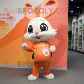 Peach Wild Rabbit mascot costume character dressed with a Graphic Tee and Brooches