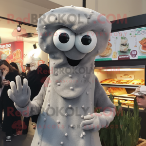 Silver Fried Calamari mascot costume character dressed with a Turtleneck and Beanies