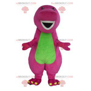 Mascotte dinosauro gigante rosa e verde paffuto e divertente -